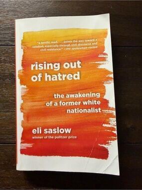 Rising Out of Hatred by Eli Saslow - Orange Gradient Paperback
